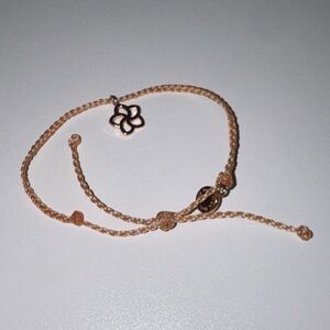 Pura Ceda Delicate Peach Braided Cord Bracelet with Flower Charm
